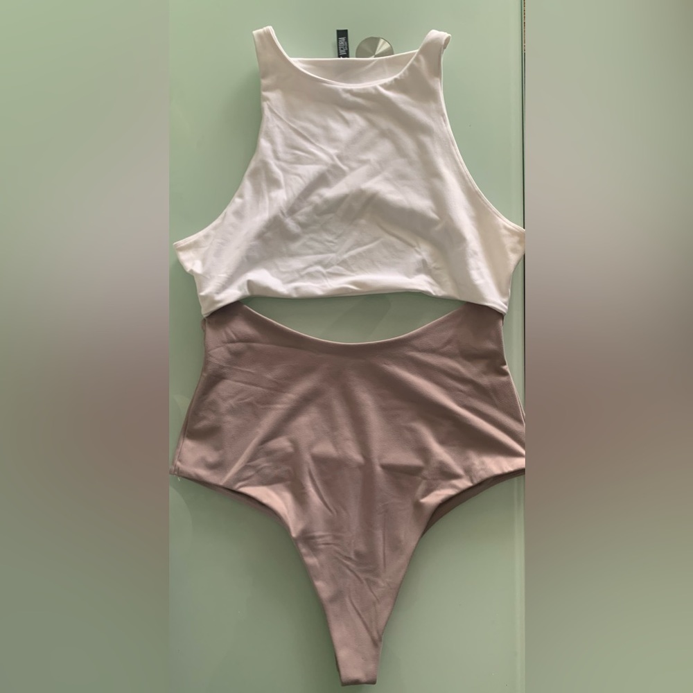 Victoria Sport Body Lining. White top and brown/ beige bottom One piece.